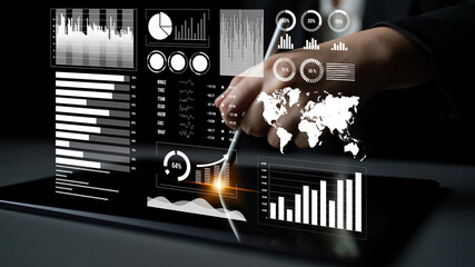 An engaging image showcasing a hand using a stylus on a tablet to view modern data analytics. Various graphs, charts, and a world map illustrate business insights effectively. Impute