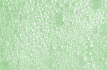 Bubbles of body gel or soap foam or shaving gel. Closeup.