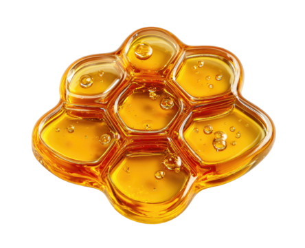 Close-up view of viscous golden liquid trapped in hexagonal cells