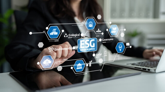A business professional engages with an innovative digital interface showcasing ESG criteria, highlighting the importance of sustainability, governance, and social responsibility. Tessel