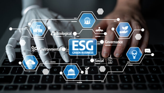 A robotic hand and a human hand interact with a keyboard, symbolizing the collaboration in implementing ESG principles for sustainable business practices in modern technology. Tessel