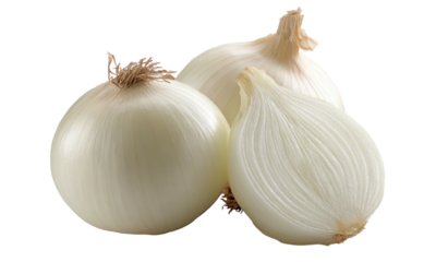 Two whole white onions and one half-sliced onion on black