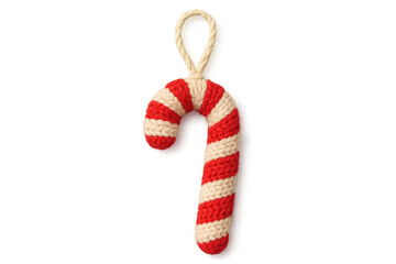 Red and white striped knitted candy cane ornament with a cozy handmade texture is a festive decoration for the winter holiday season, showing detailed yarn craft