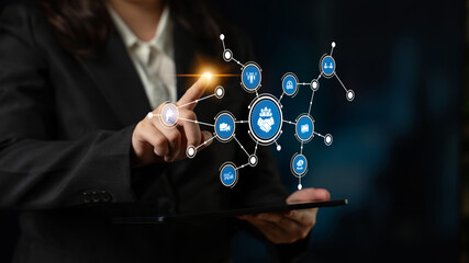 Professional businesswoman engages with a digital interface showcasing various data connections and analytics, symbolizing innovation and technological advancement in the modern workspace. Tessel