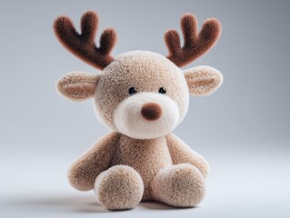 Cute stuffed reindeer toy with fluffy antlers and soft fur, sitting on a neutral background.