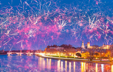 Fototapeta premium Pont Saint Benezet bridge on the Rhone River and Palace of the Popes ( Palais des Papes) and Avignon Cathedral with fireworks - Avignon city, France