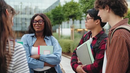 Group of university students talking in urban campus in the city - African American college girl with friends after classes - Powered by Adobe