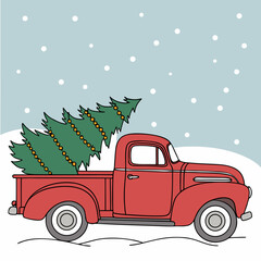 Vintage red truck carrying christmas trees in the snow