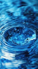 Water droplet splashing, creating ripples in blue liquid