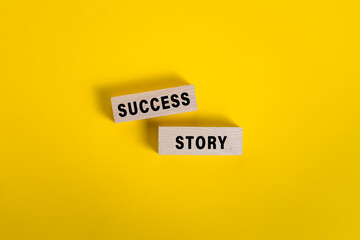 success story words on wooden blocks isolated on yellow background