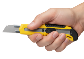 Hand firmly holding a sharp yellow utility knife, precision cutting tool ready for crafting projects or industrial tasks with durable blade, versatile tool