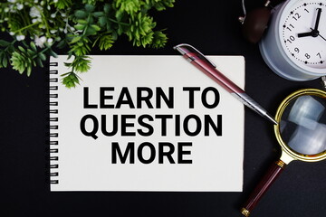 Learn To Question More text with alarm clock and magnifying glass
