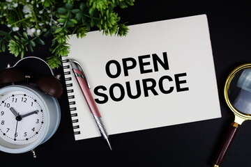 Open Source text with alarm clock and magnifying glass