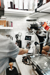 Barista preparing fresh coffee in a cozy coffee shop during the morning rush