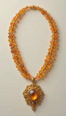 Exquisite amber necklace with intricate gold detailing and beautiful pendant on light background
