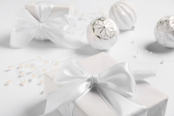 Christmas composition with gift box and decor on white background, closeup