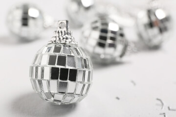 Composition with Christmas balls on white background, closeup
