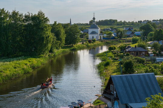 Panoramic view of the Kamenka River and the Church of the Epiphany of Christ (Epiphany Church) in Kozhevennaya Sloboda on a sunny summer day, Suzdal, Vladimir region, Russia