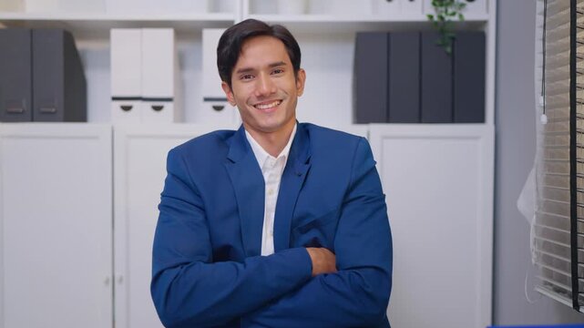 Portrait of Asian young businessman working in the office workplace. 