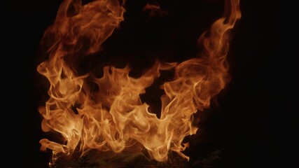 Intense burning fire texture for overlay layer effects. Flame abstract design. Glowing flames on black. Inferno effect with flame. Flames with dramatic fire slow motion. Burning flame.