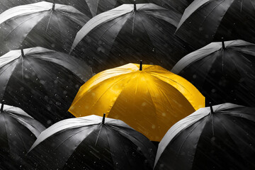 Glowing shiny golden umbrella stand out in crowd