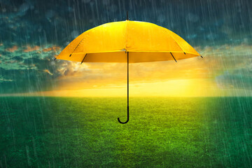 Yellow umbrella in the rain, climate change background