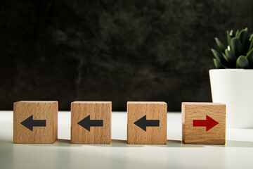 New ways of working, differentiation strategy concept symbol on wood blocks. Providing uniqueness, different and distinct from competitors, creating competitive advantage. Business direction concept.