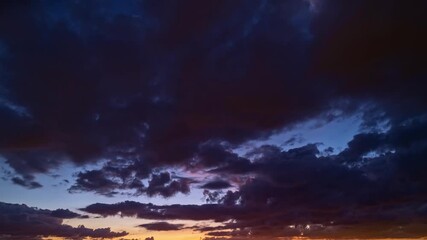 Sunset with sun and clouds on blue and orange dramatic sky. Sky sunset timelapse. Evening Sky, Sunset sky clouds with Red, Orange, Yellow sunlight after golden sundown on Dark blue Twilight. - Powered by Adobe