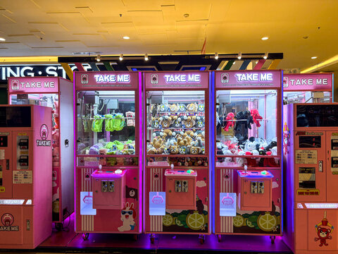 Row of Claw Machines in a Shopping Mall Arcade with Toys