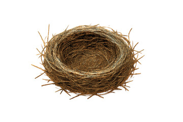 Obraz premium Empty bird nest made of dry twigs and grass fibers isolated on white background