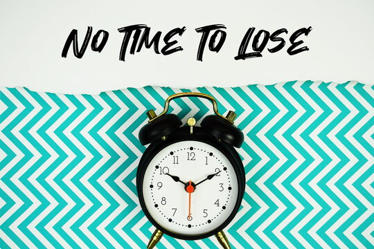 No Time To Lose text written on paper with alarm clock on green chevron background
