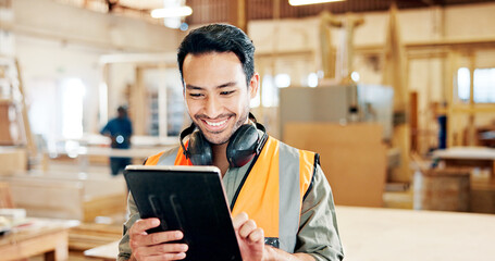 Man, carpenter and tablet with smile at workshop, scroll and review with furniture manufacturing job. Person, click and happy with tech for woodwork, application and feedback for design at factory