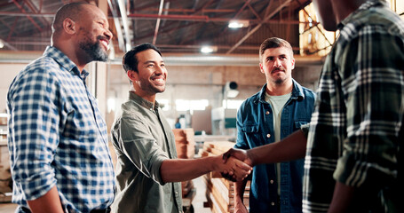Carpentry, handshake and people in meeting in workshop for woodworking, timber business and agreement. Carpenter, collaboration and workers shaking hands for lumber production, deal and partnership