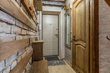 Rustic Hallway with Brick Wall and Wooden Doors Interior