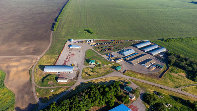 Manufacturing facilities in the context of a green landscape and forest-based approach to secure industrial operations. Factory in the green forest. High quality photo