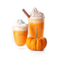 Glasses of orange pumpkin latte with whipped cream and cinnamon on color background