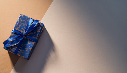 Stunning blue gift box with gold floral design and ribbon, perfect for celebrations, birthdays, or holidays with elegant design, creating a memorable moment