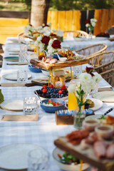 Elegant outdoor dining setup with a variety of dishes