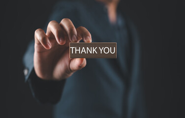 Show a text thank you from the laptop. Concept of thank you in business, Presentation in technology digital. Gift of grateful