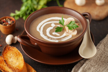 Homemade mushroom soup in bowl on the table.
