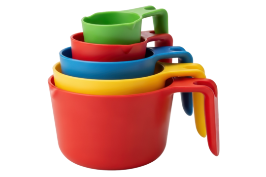 Set of stacked bright colorful plastic measuring cups for kitchen use on a transparent background