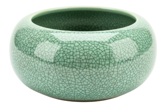 Green ceramic bowl with decorative crackle glaze pattern on a transparent background