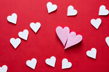 Pink Paper Hearts on Red Textured Background - Valentine's Day Concept