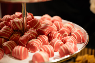 Zurich, Switzerland, November 22 2025. Variety of chocolate truffles and handmade British fudge on display trays at one of the Christmas market shops or stalls