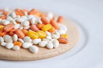 Colorful Cowrie Shells on Wooden Surface - Natural Treasures