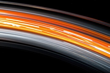 Arcing light streaks of white, orange, over dark background