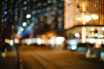 Abstract background of blurry city lights or bokeh lights at night. Blurry Christmas string lights, out of focus, no people, wide angle