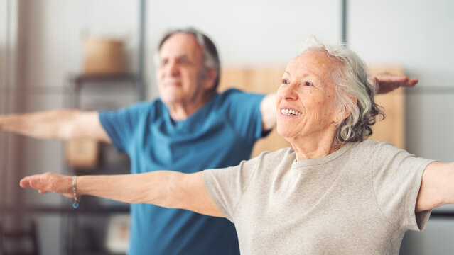 An elderly couple exercising