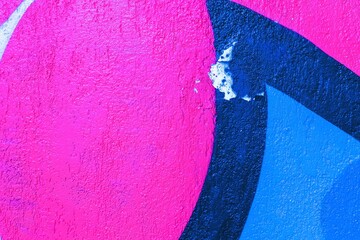 Obraz premium Abstract graffiti pattern with vibrant pink and blue colors. Funky, vibrant aesthetic, reminiscent of 90s street art. Urban walls, creative banners, digital art, modern 90s visuals.