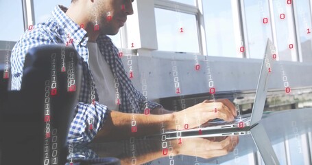 Coding man plaid shirt sleeves rolled typing on laptop by windows with binary overlay, copy space